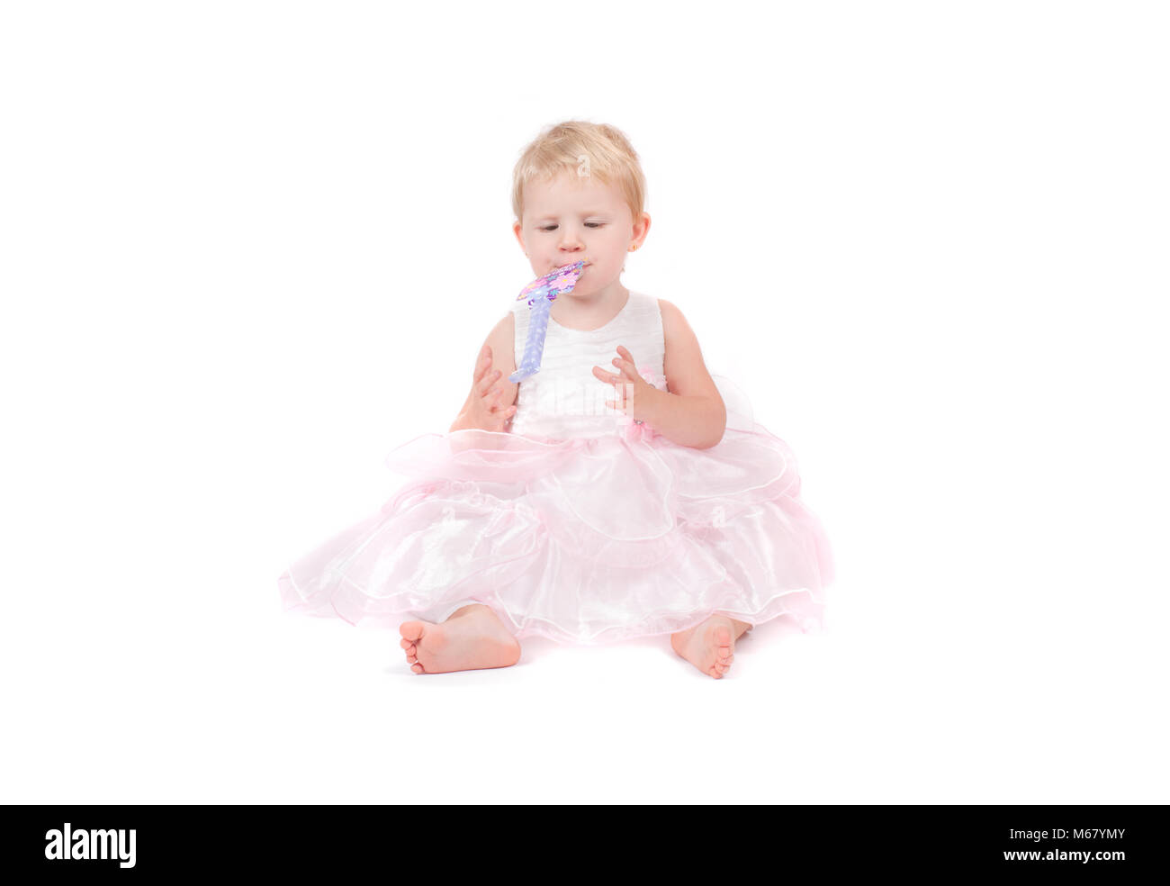 The baby girl in a pink dress isolated on the white background Stock ...