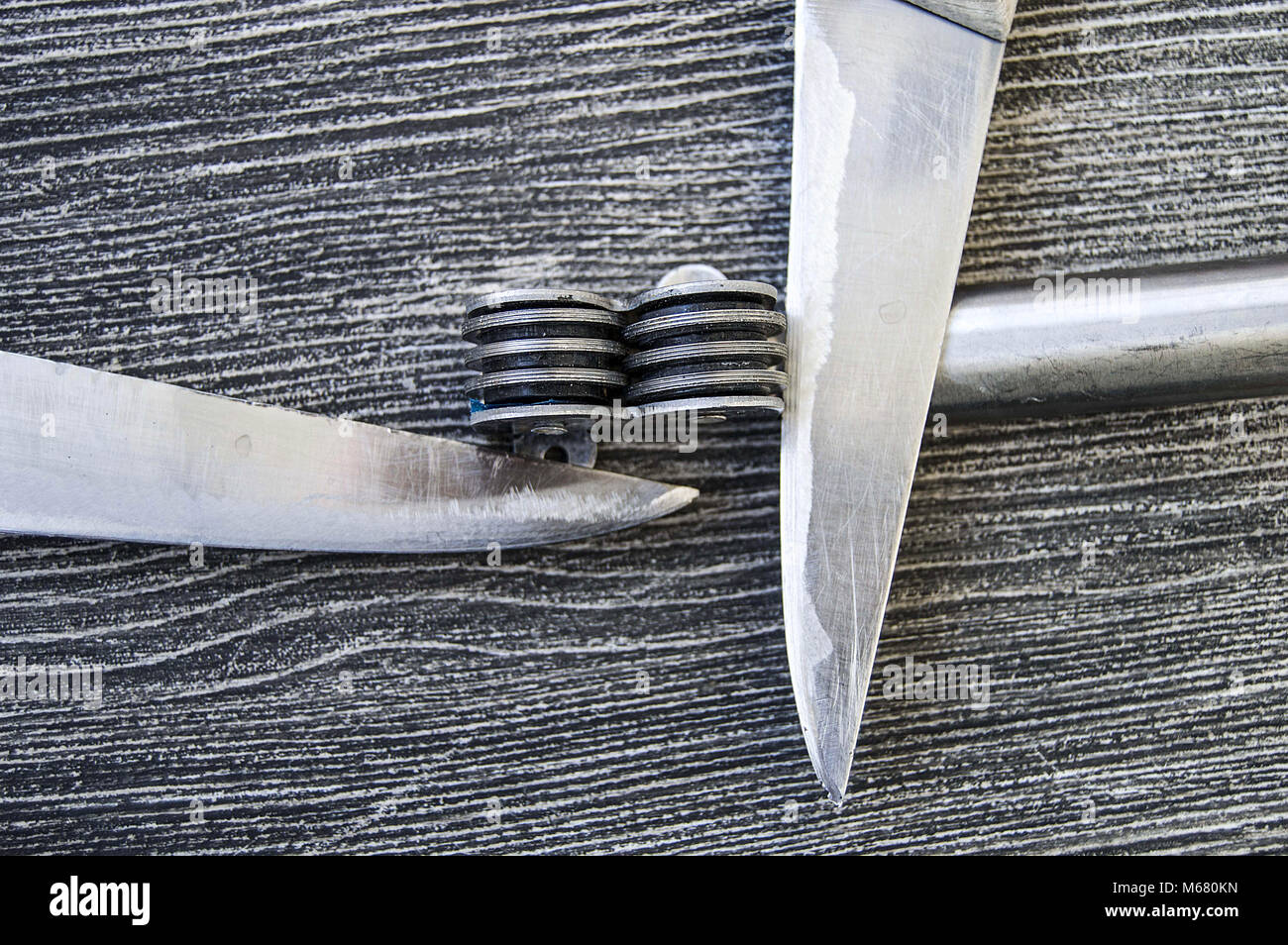 Knives stands next to the blade grinding tools, knife sharpening tool