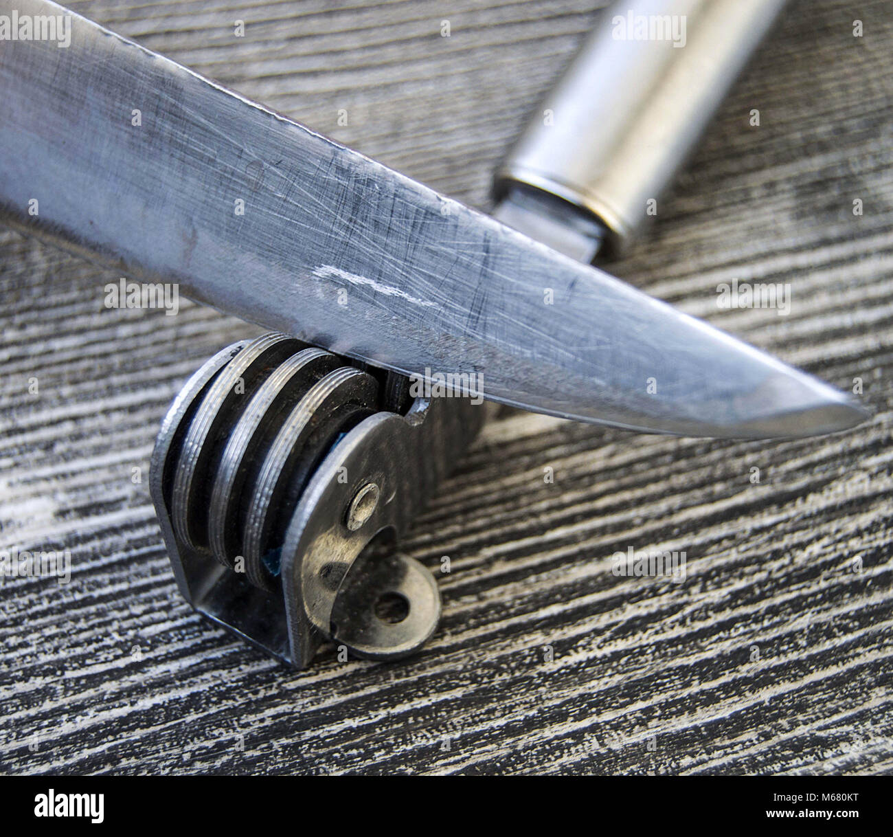 Knives stands next to the blade grinding tools, knife sharpening tool