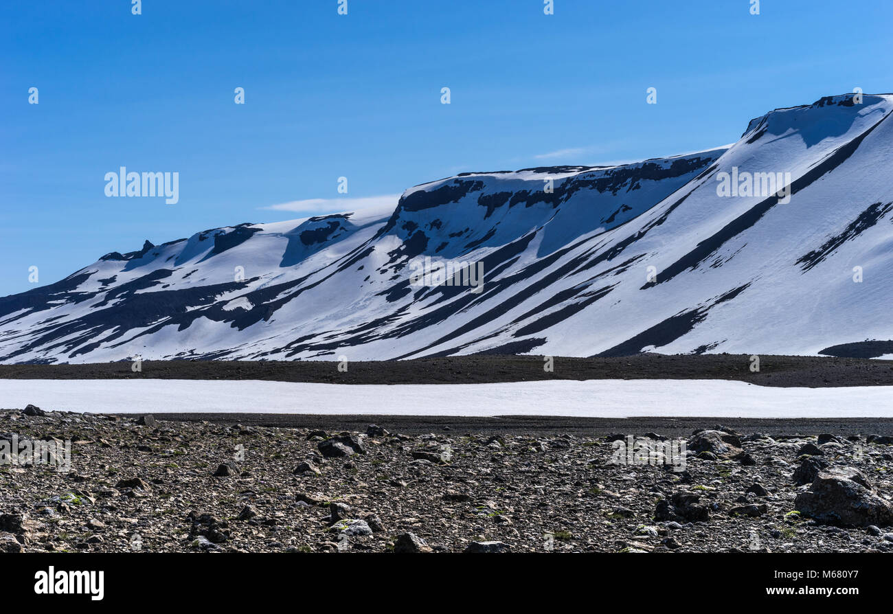 Volcano Ridge Dramatic Snow Covered Volcanic Ridge against a Blue Sky, Western ...