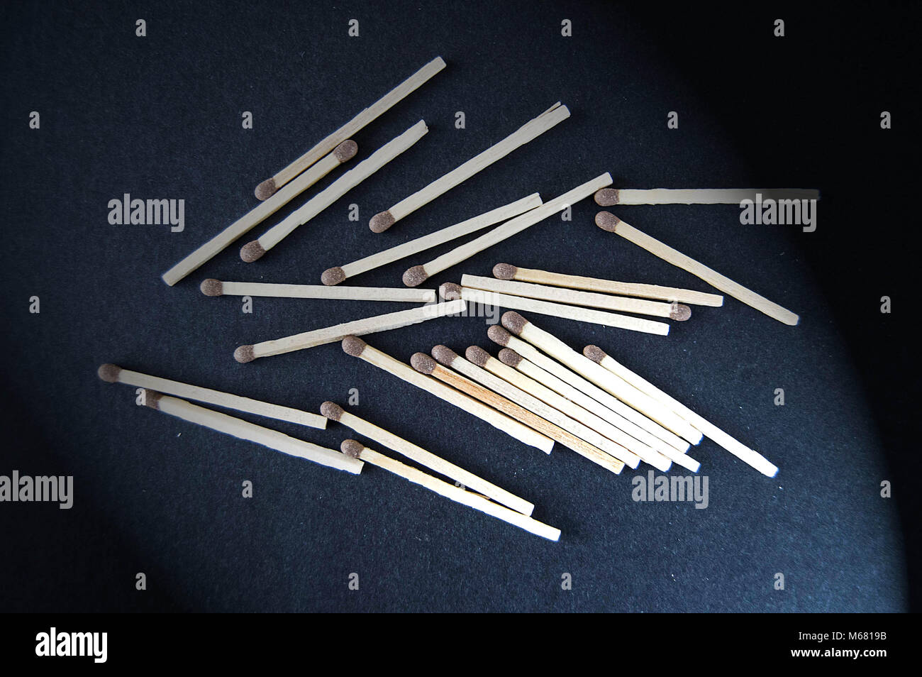 there is a matchbox with a black background, and there are dozens of