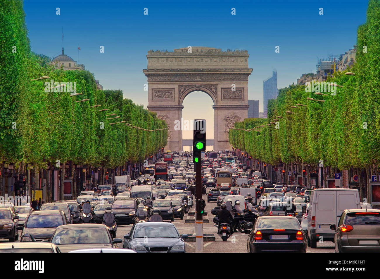 traffic jam with cars in Paris city, France. view of Arc de Triomphe and Champs-Élysées boulevard Stock Photo