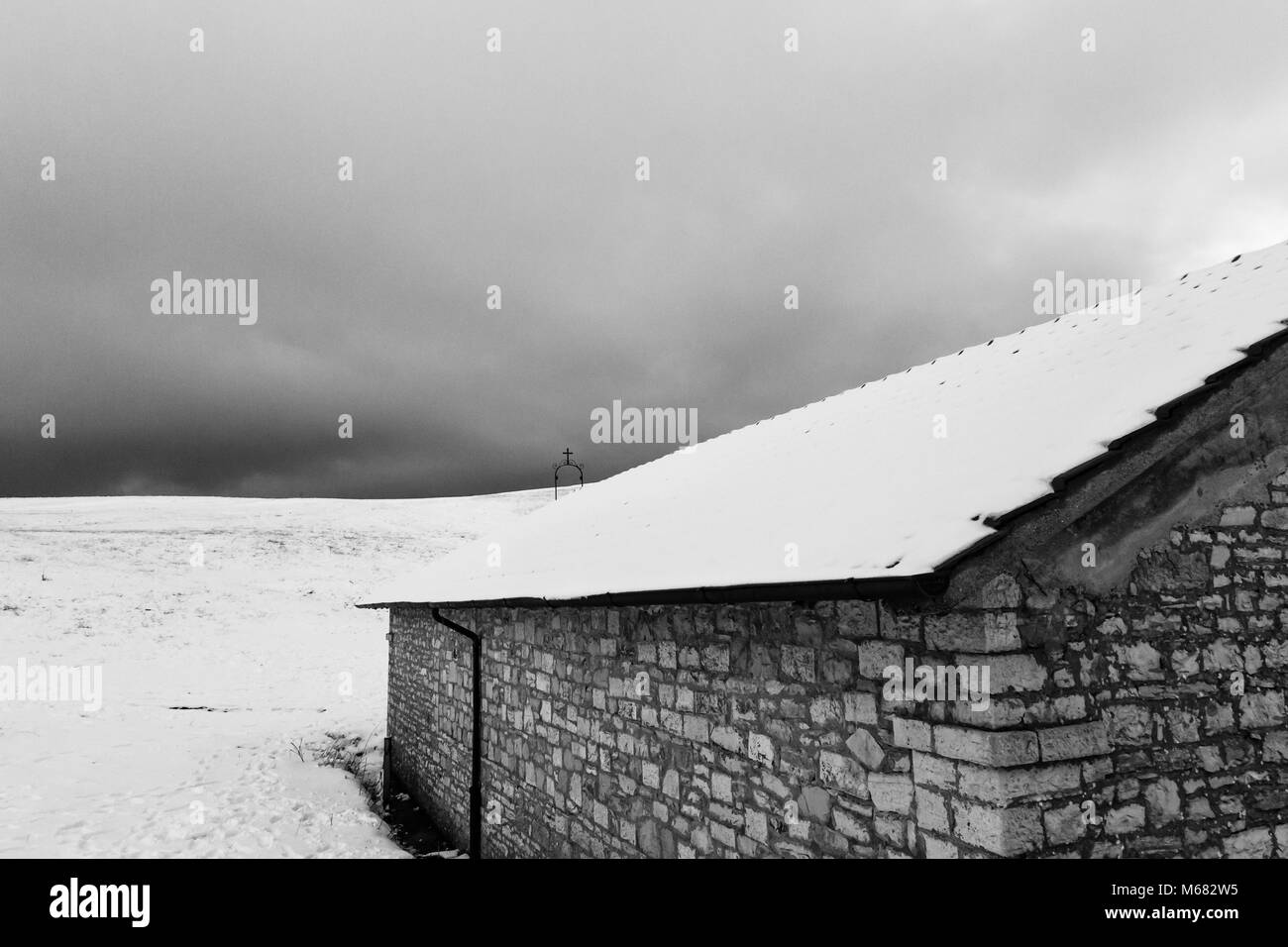 A small mountain retreat covered by snow on Mt. Subasio (Umbria, Italy) during winter season Stock Photo