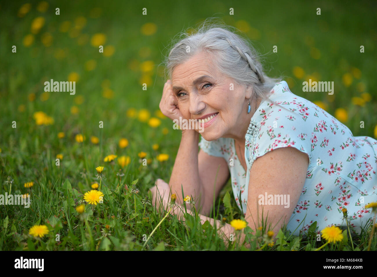 elderly woman lying Stock Photo - Alamy