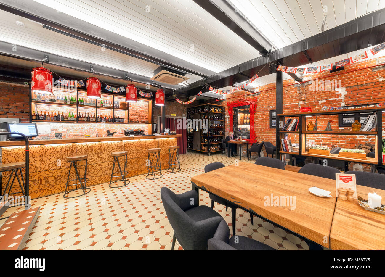 Interior of the Russian farm restaurant 'LAVKALAVKA'. Wooden bar counter Stock Photo