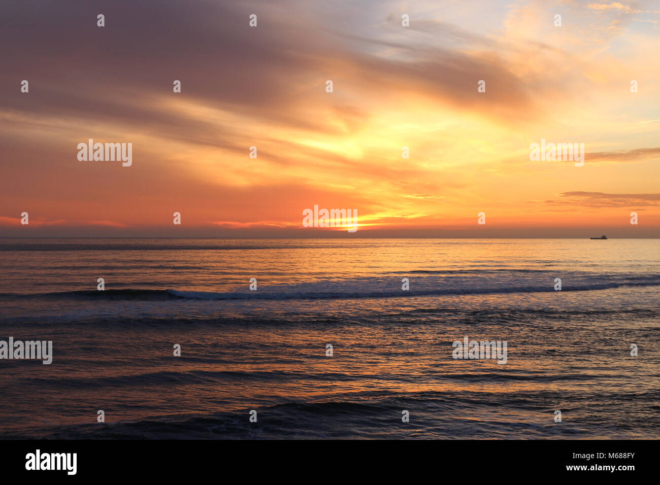 Sunset on the beach Stock Photo - Alamy