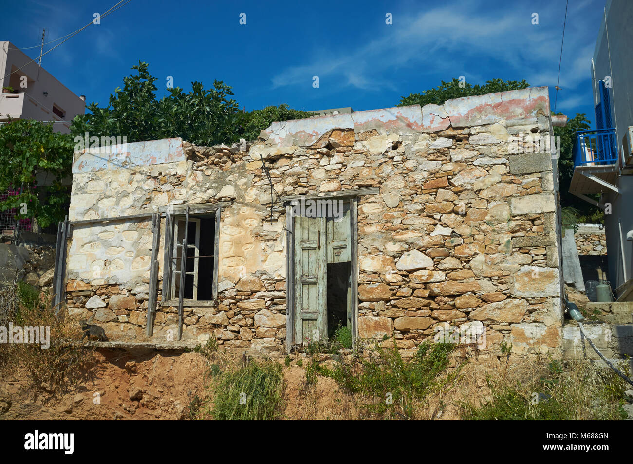 An old abandoned building in the village of Voulgari, Syros (aka Siros or Syra), Cyclades, Greece. Stock Photo