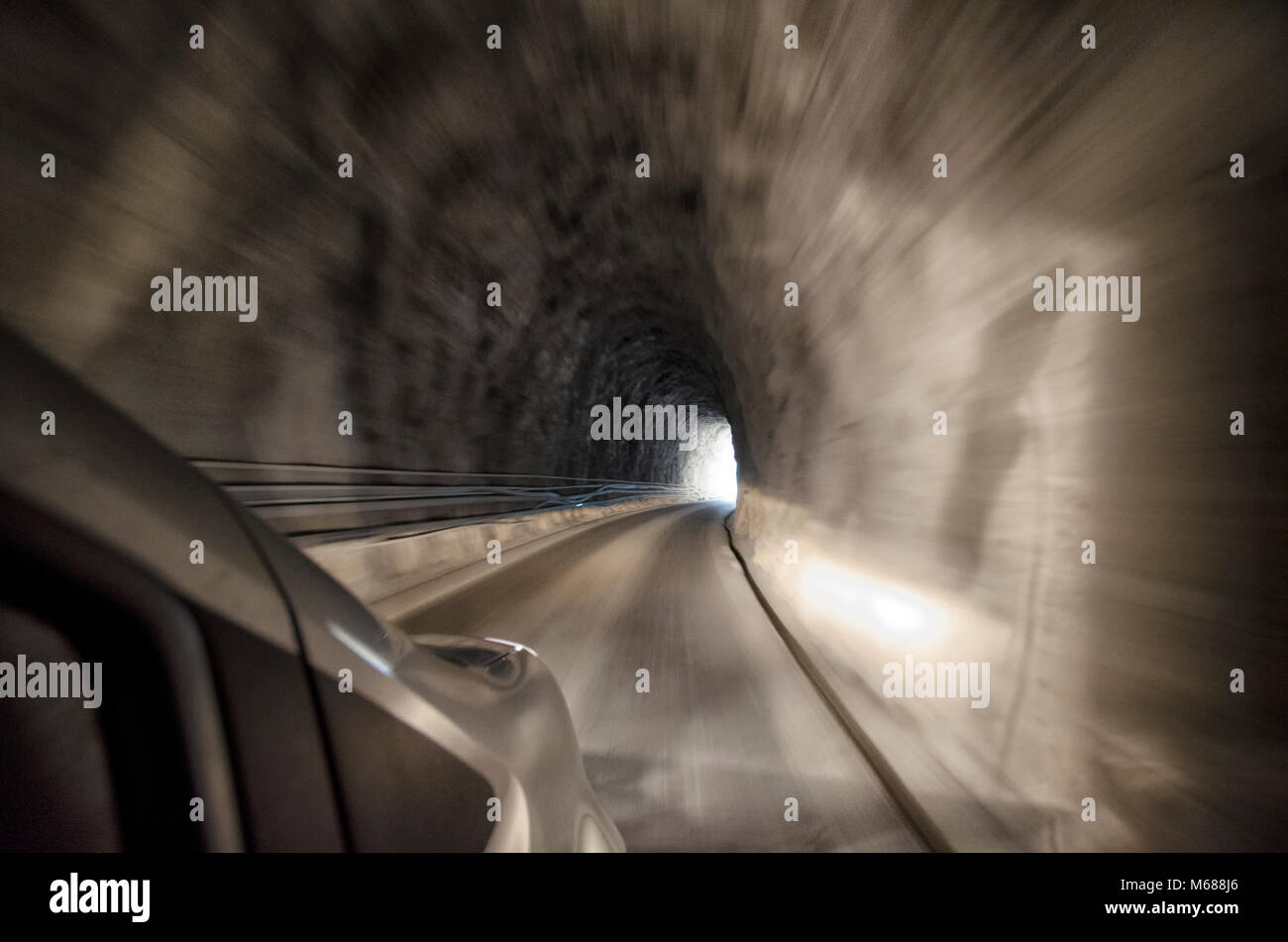 View of a carved tunnel from inside the car Stock Photo