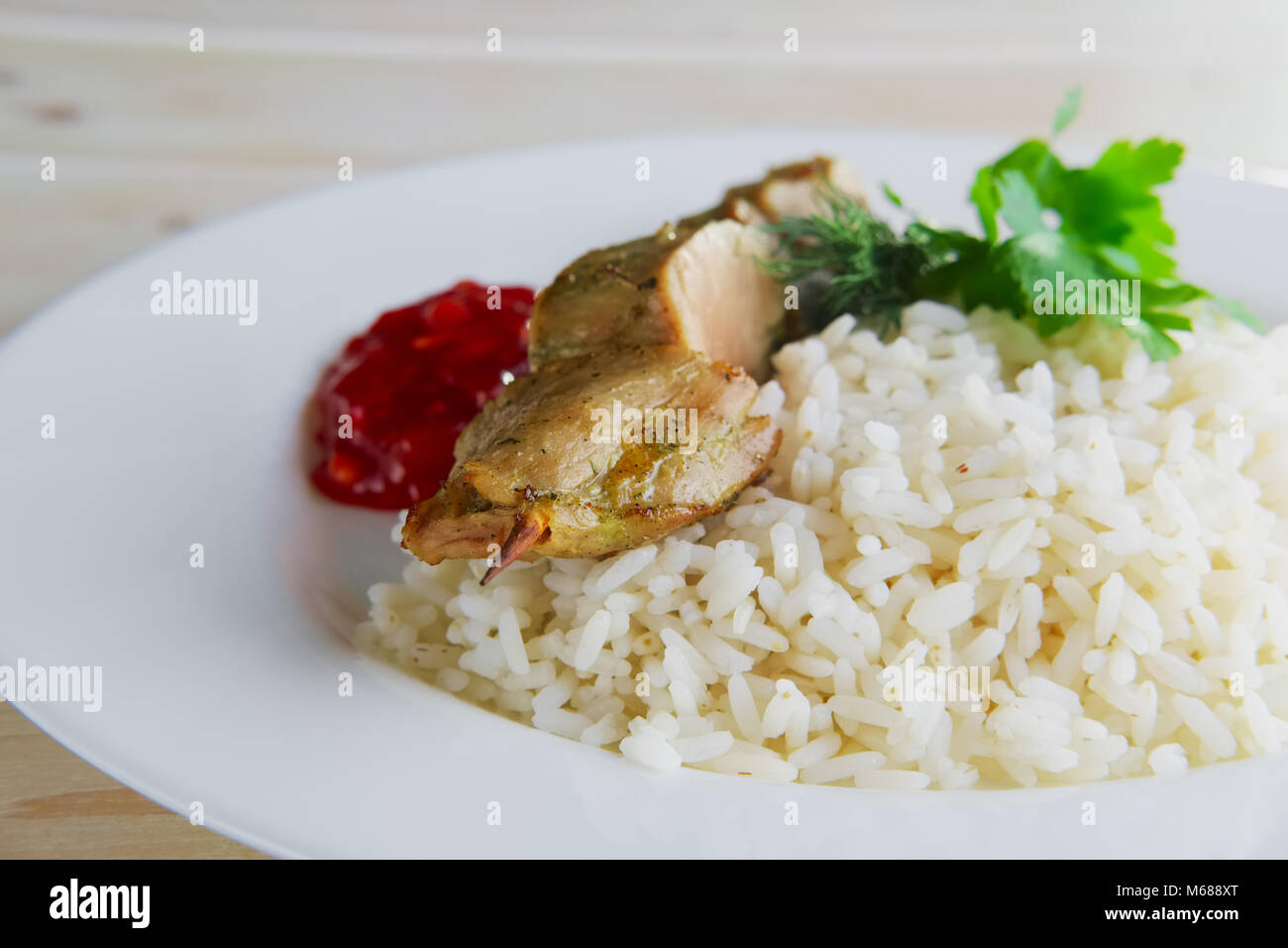 Pork shaslyk with rice and tomato sauce Stock Photo Alamy