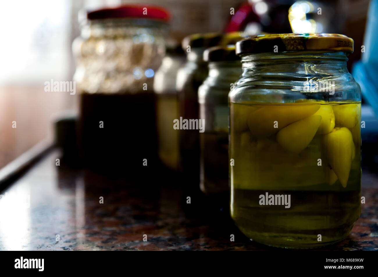jars of pickles on the kitchen counter Stock Photo