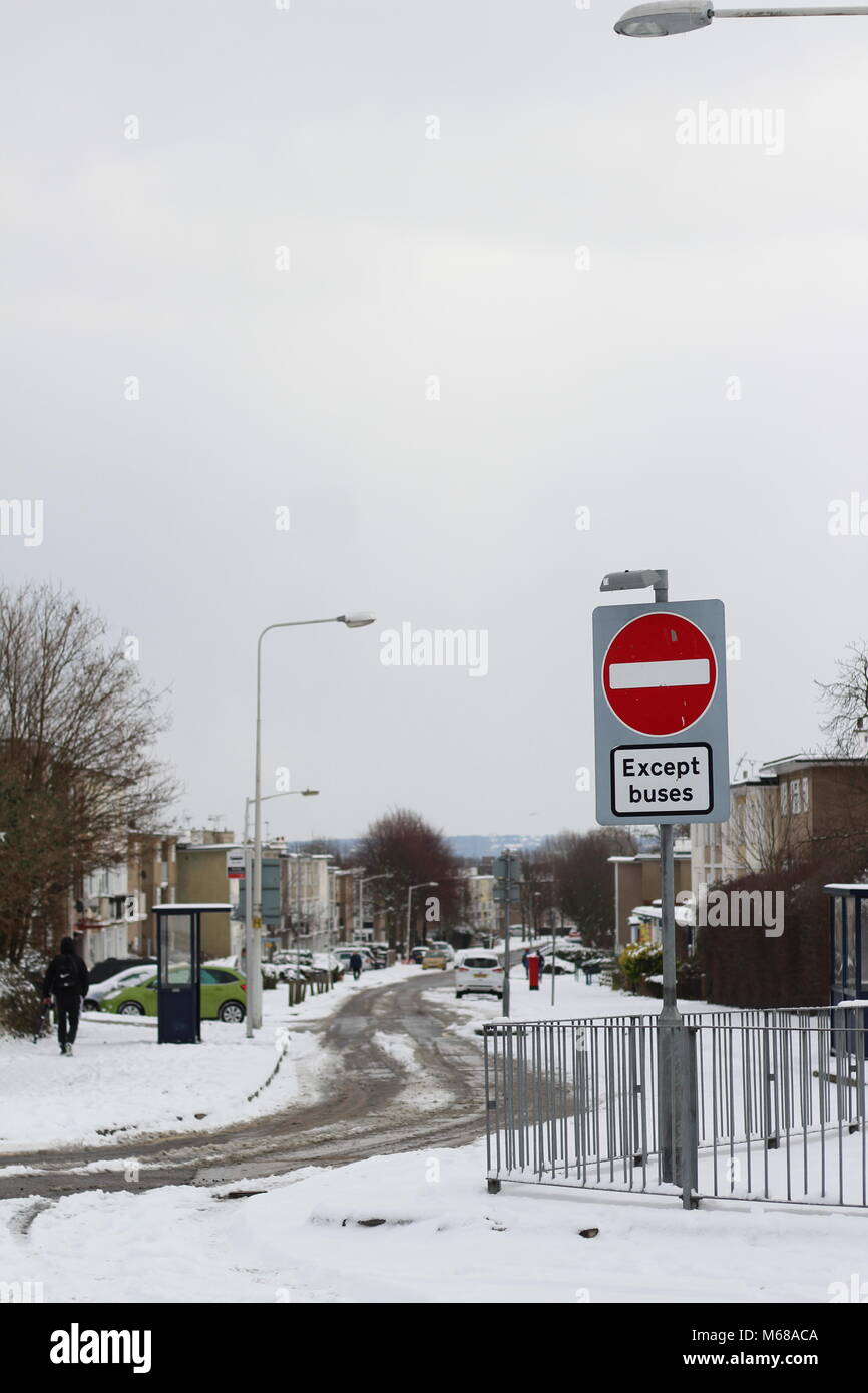 A view of a snowy street from across the junction to the bus lane, Long Riding, Basildon, Essex