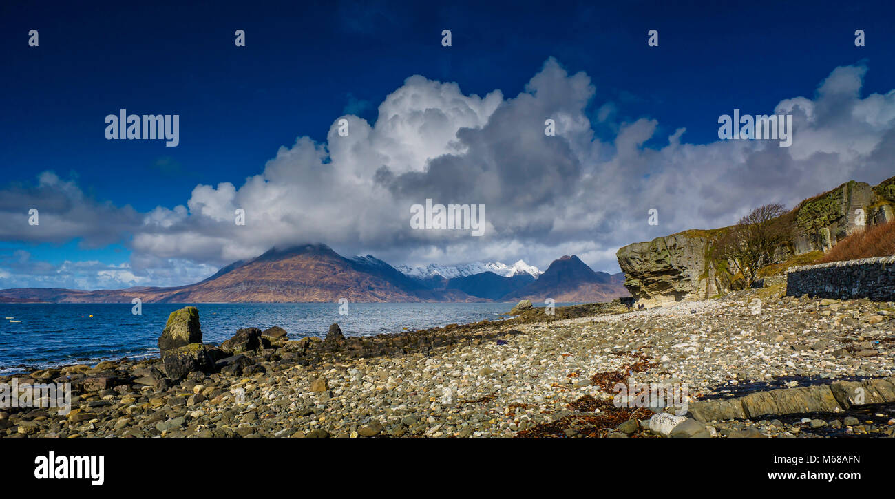 The rocky beach at Elgol on the Isle of Skye with the Cuillins behind. Stock Photo