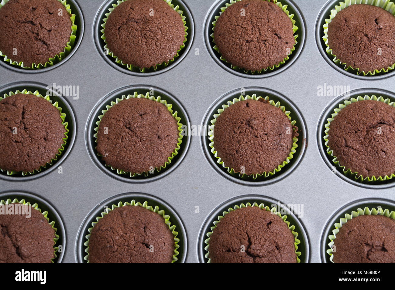Freshly baked chocolate cakes in the tin Stock Photo Alamy