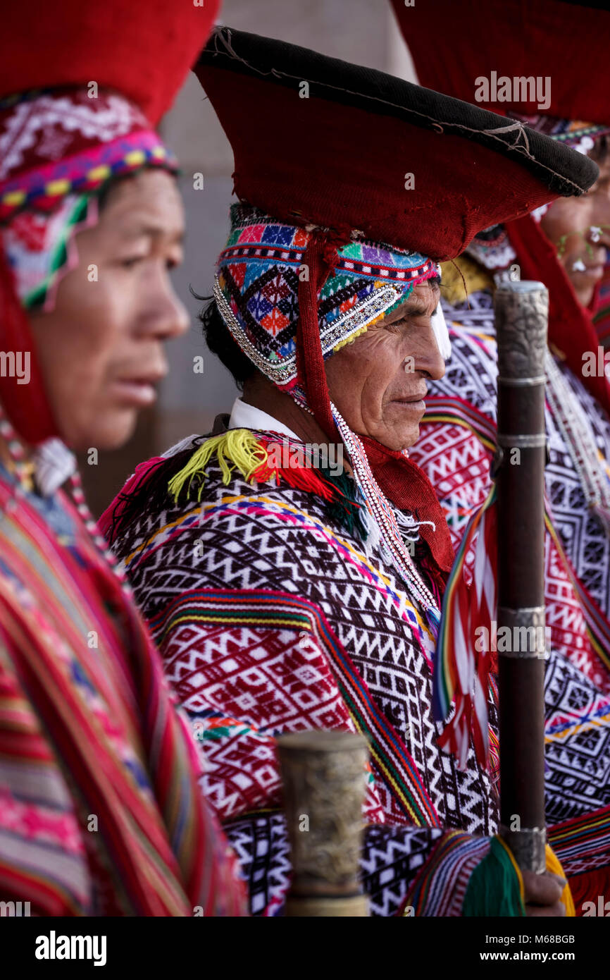 Local Quechua mayors (varayocs) dressed in traditional costumes before mass, Pisac Sunday Market, Cusco, Peru Stock Photo
