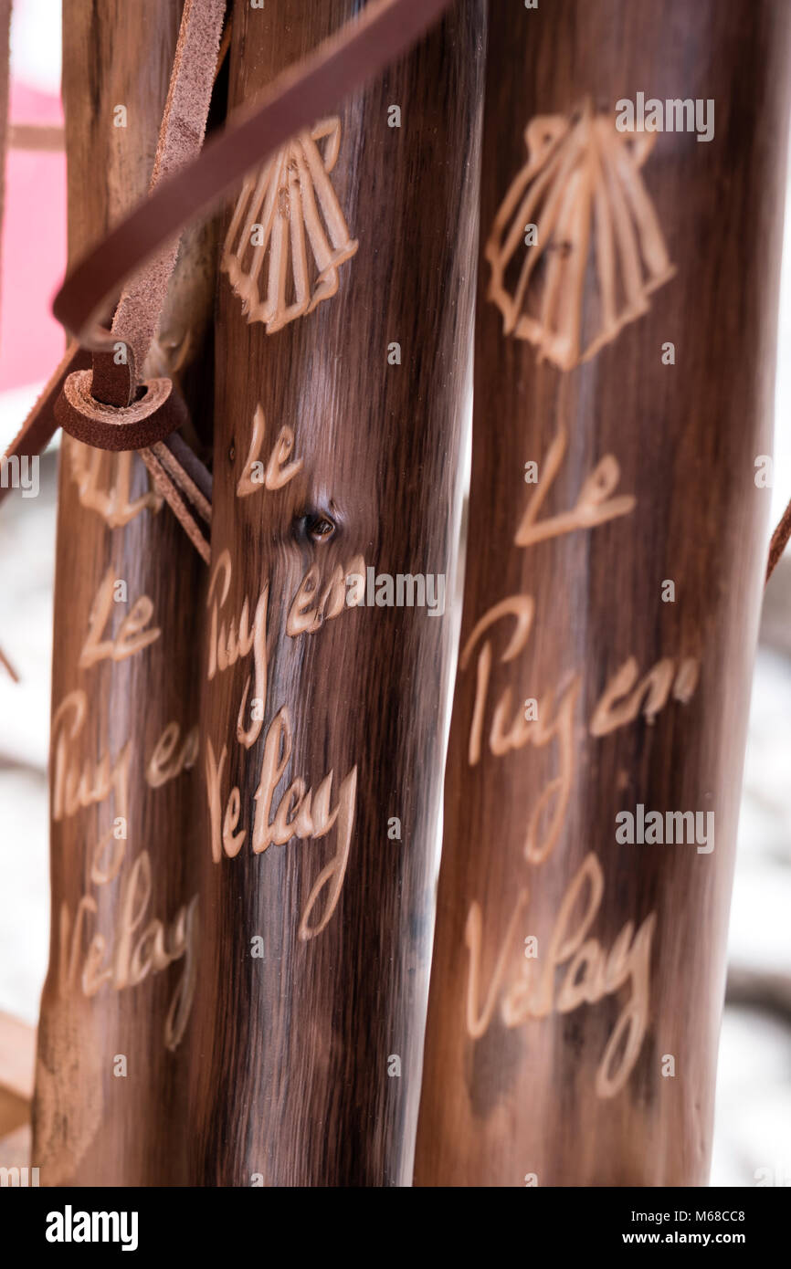 Wood carving on walking poles Le Puy en Velay Haute-Loire Auvergne-Rhône-Alpes France Stock Photo