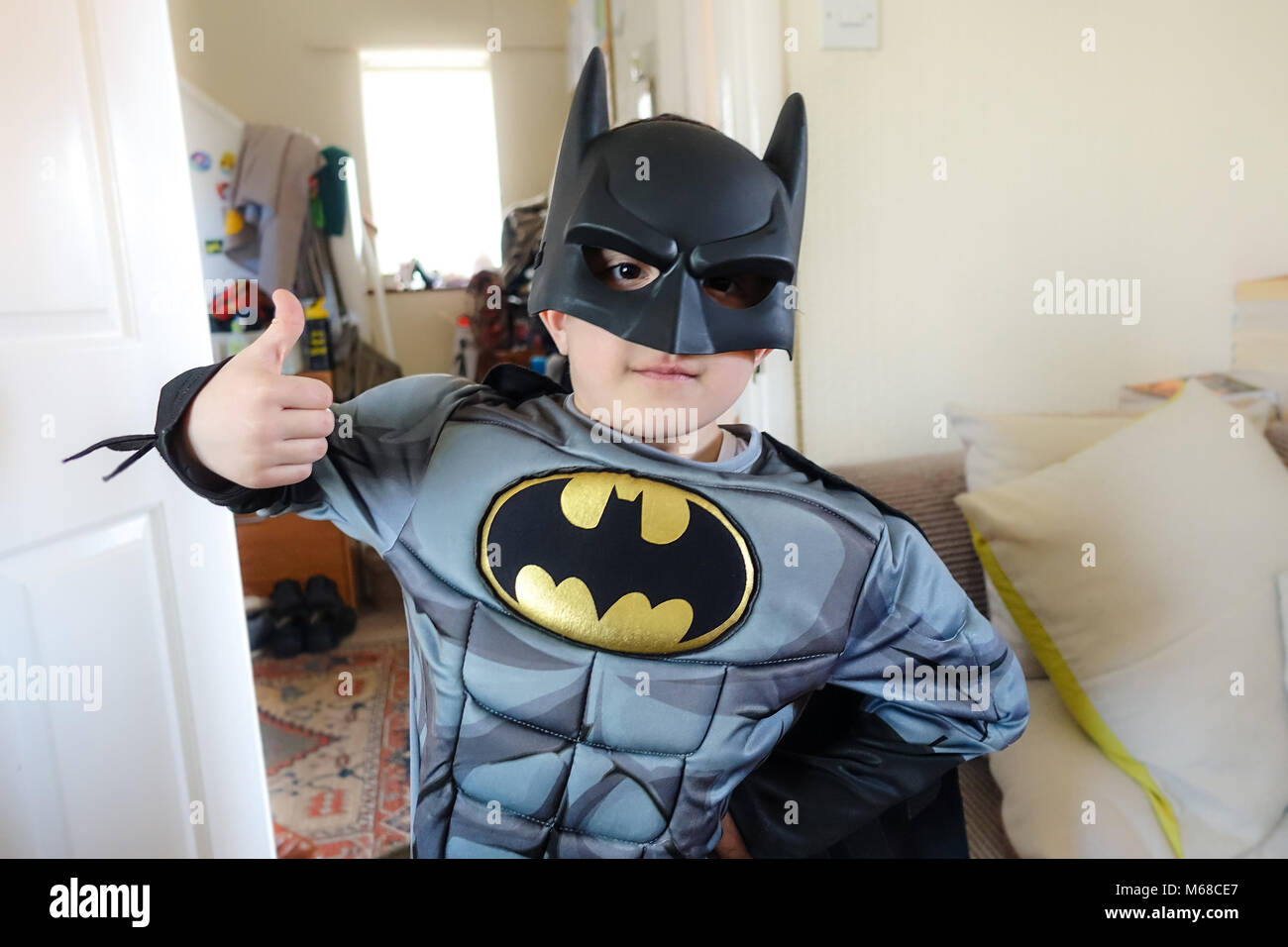 A young boy dressed up in a batman super hero costume. Stock Photo