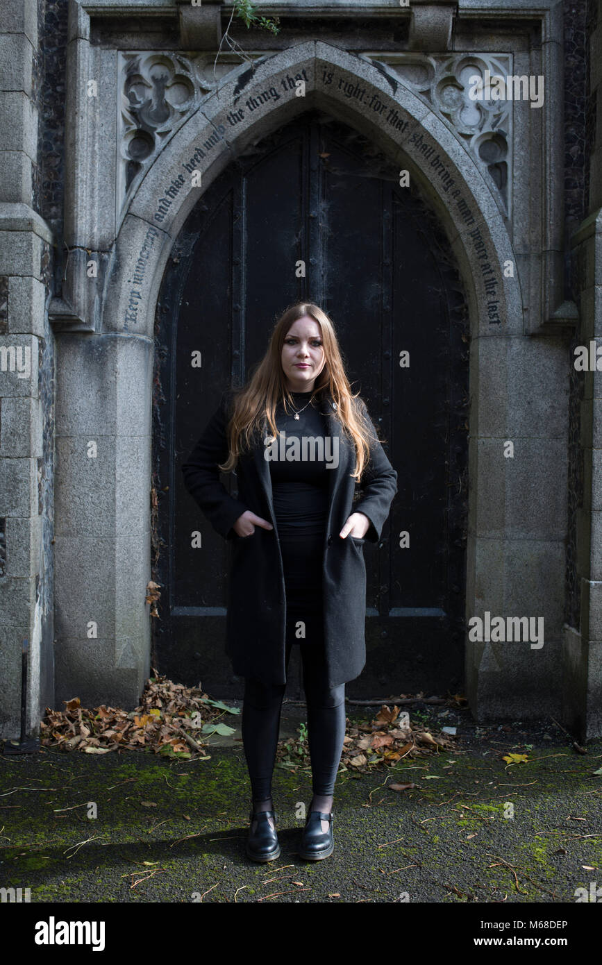 a female funeral director stands in a brighton gothic victorian