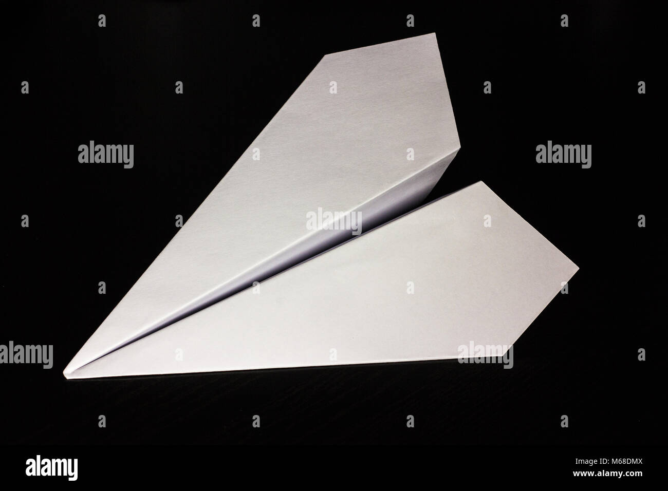 Download Paper Airplane On A Dark Background For Design And Flight Of Stock Photo Alamy PSD Mockup Templates