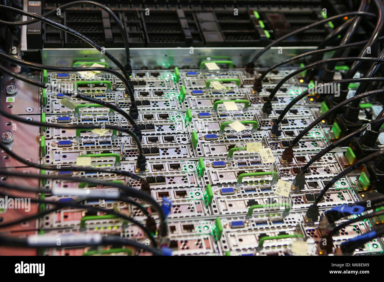 Hanover, Germany. 19th March, 2017. CeBIT 2017, ICT trade fair: Fujitsu Liquid Immersion Cooling System for data center servers, at booth of Fujitsu. Immersing servers in a fluorocarbon-based inert fluid (here 3M Fluorinert) provides greater cooling performance, eliminates the need for server fans and reduces total cooling equipment power consumption. Credit: Christian Lademann Stock Photo