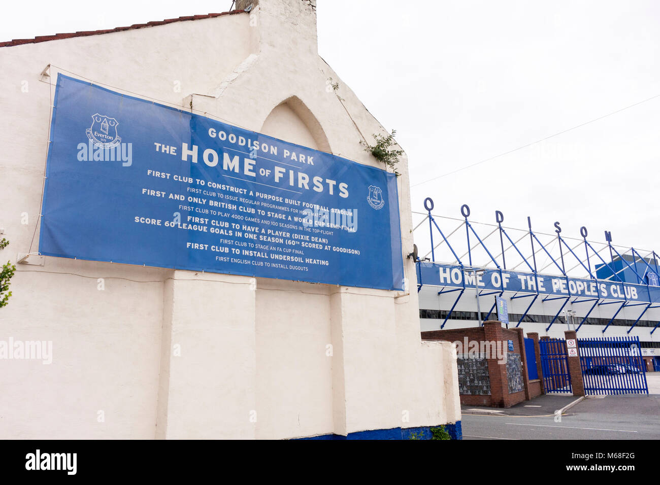 A banner detailing Everton FC 'firsts' hanging up on a building outside Goodison Park. Liverpool, Merseyside Stock Photo