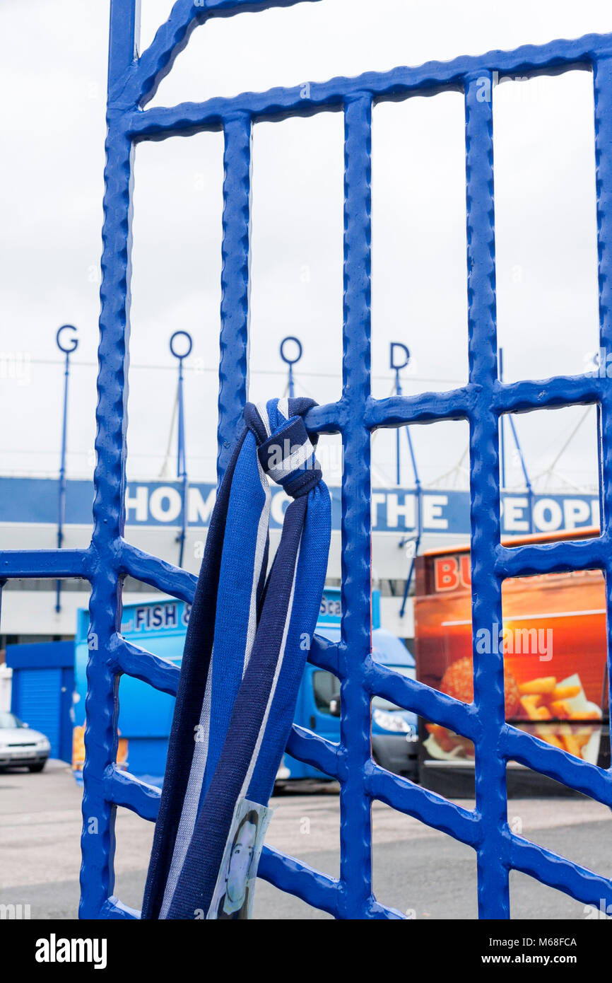 A blue and white scarf tied to the gate outside Goodison Park, Everton Football Club's ground. Liverpool, Merseyside, UK Stock Photo