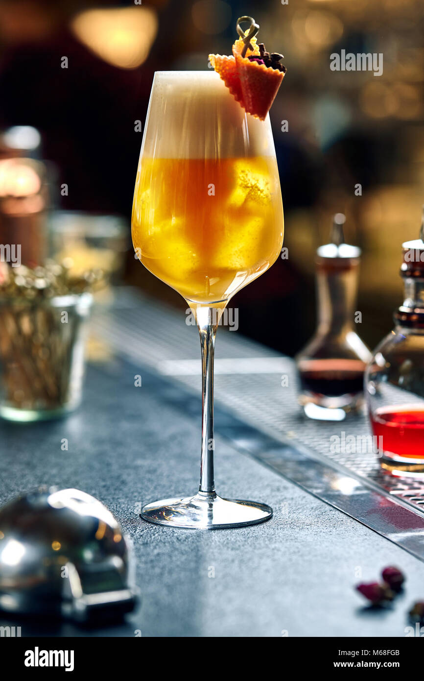 Rosemary cocktail golden rum, rosemary, fruits juice and syrup Stock Photo Alamy