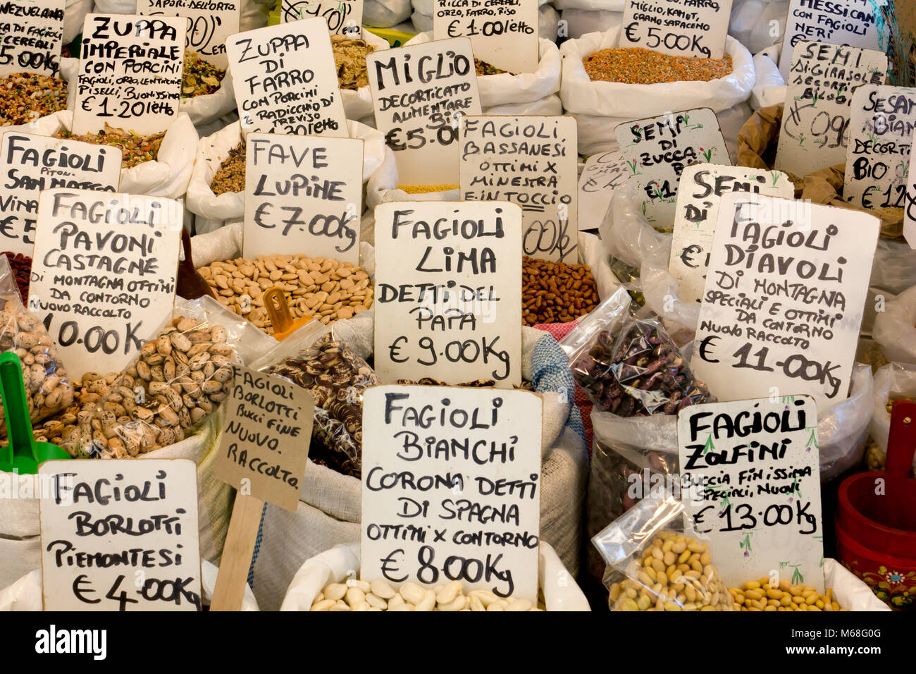 Beans, other legumes, seeds and cereals on a stand in an Italian open air market Stock Photo