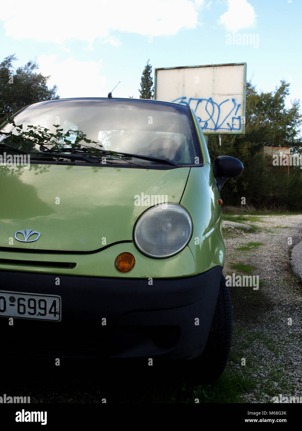 Daewoo Matiz parked on country road in Corfu, Greece Stock Photo
