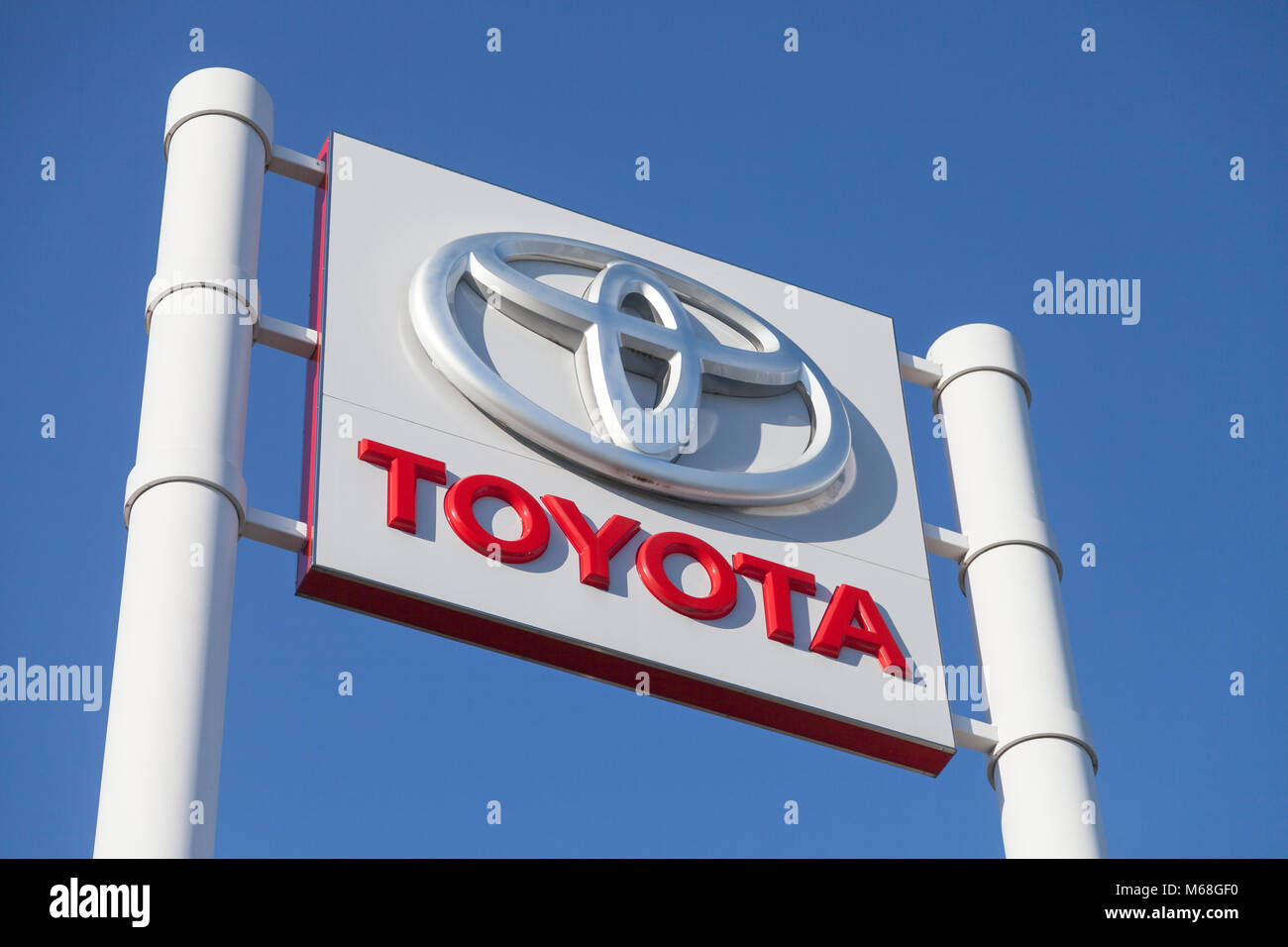 FUERTH / GERMANY - FEBRUARY 25, 2018: Toyota logo near a car dealer building. Toyota Motor Corporation is a Japanese multinational automotive manufact Stock Photo
