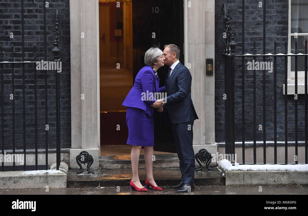 Prime Minister Theresa May greets European Council president Donald Tusk ahead of a meeting at Downing Street, London. Stock Photo