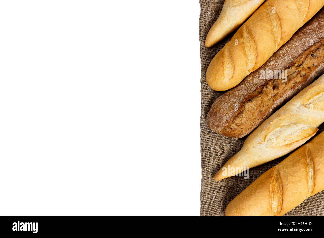 baguette of whole wheat bread on a white background Stock Photo Alamy
