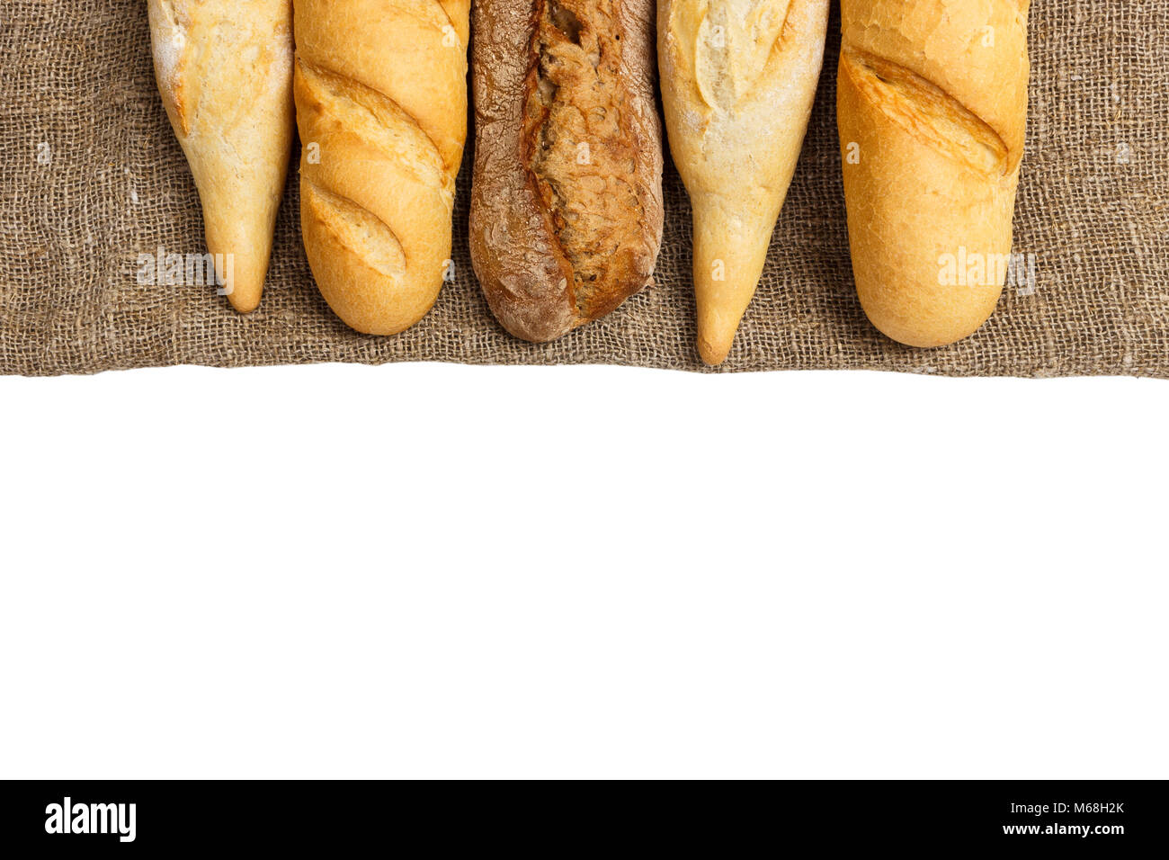 baguette of whole wheat bread on a white background Stock Photo - Alamy
