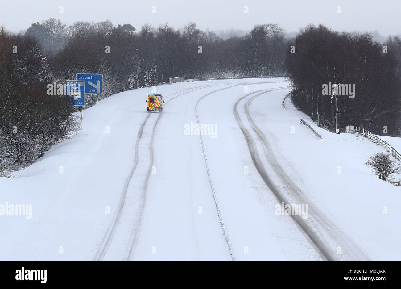 An ambulance on the M876 in snowy conditions, near Falkirk, as storm Emma, rolling in from the Atlantic, looks poised to meet the Beast from the East's chilly Russia air - causing further widespread snowfall and bitter temperatures. Stock Photo