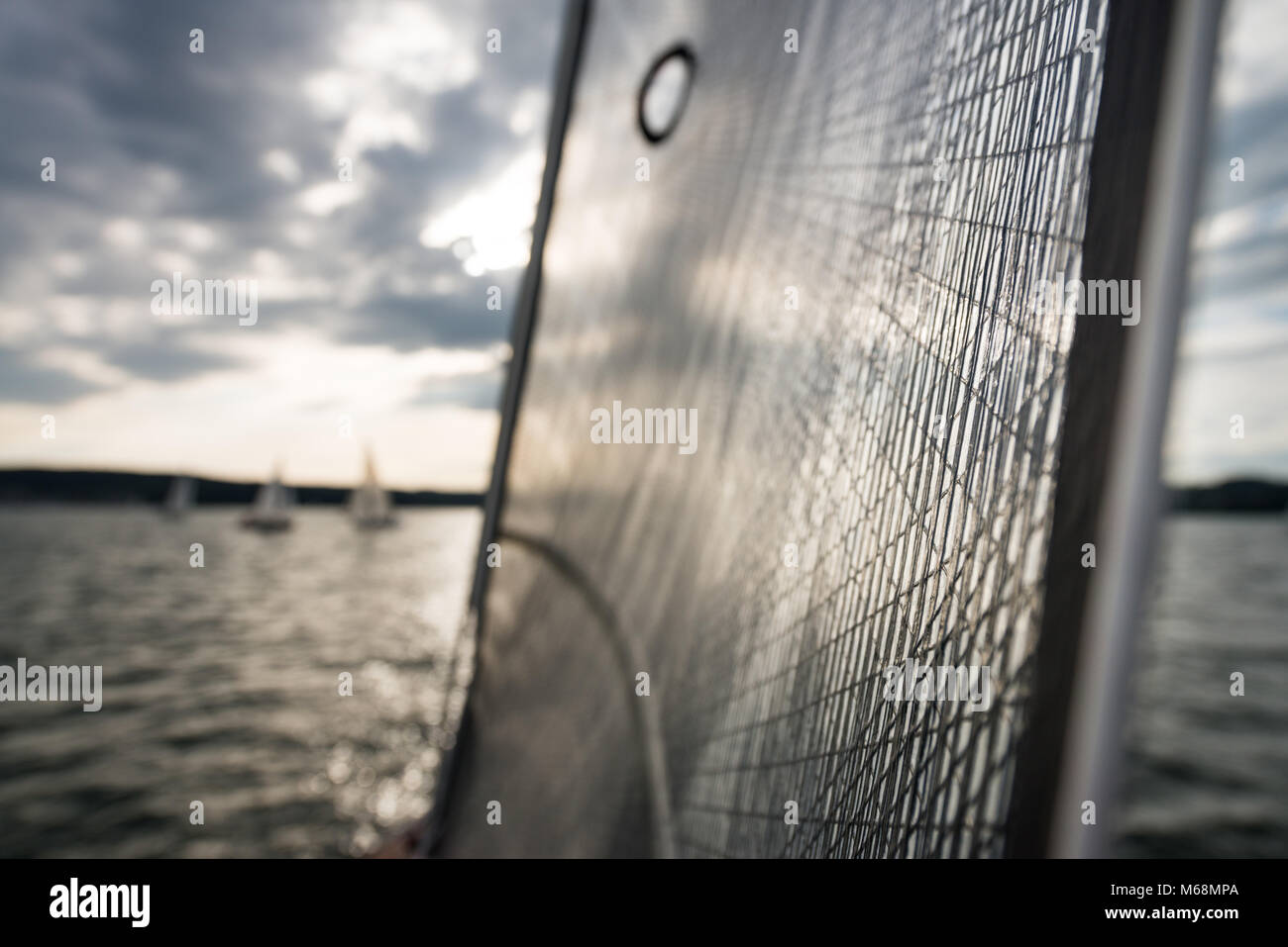 Sails canvas and mast against great cloudy sky - shallow depth of field Stock Photo