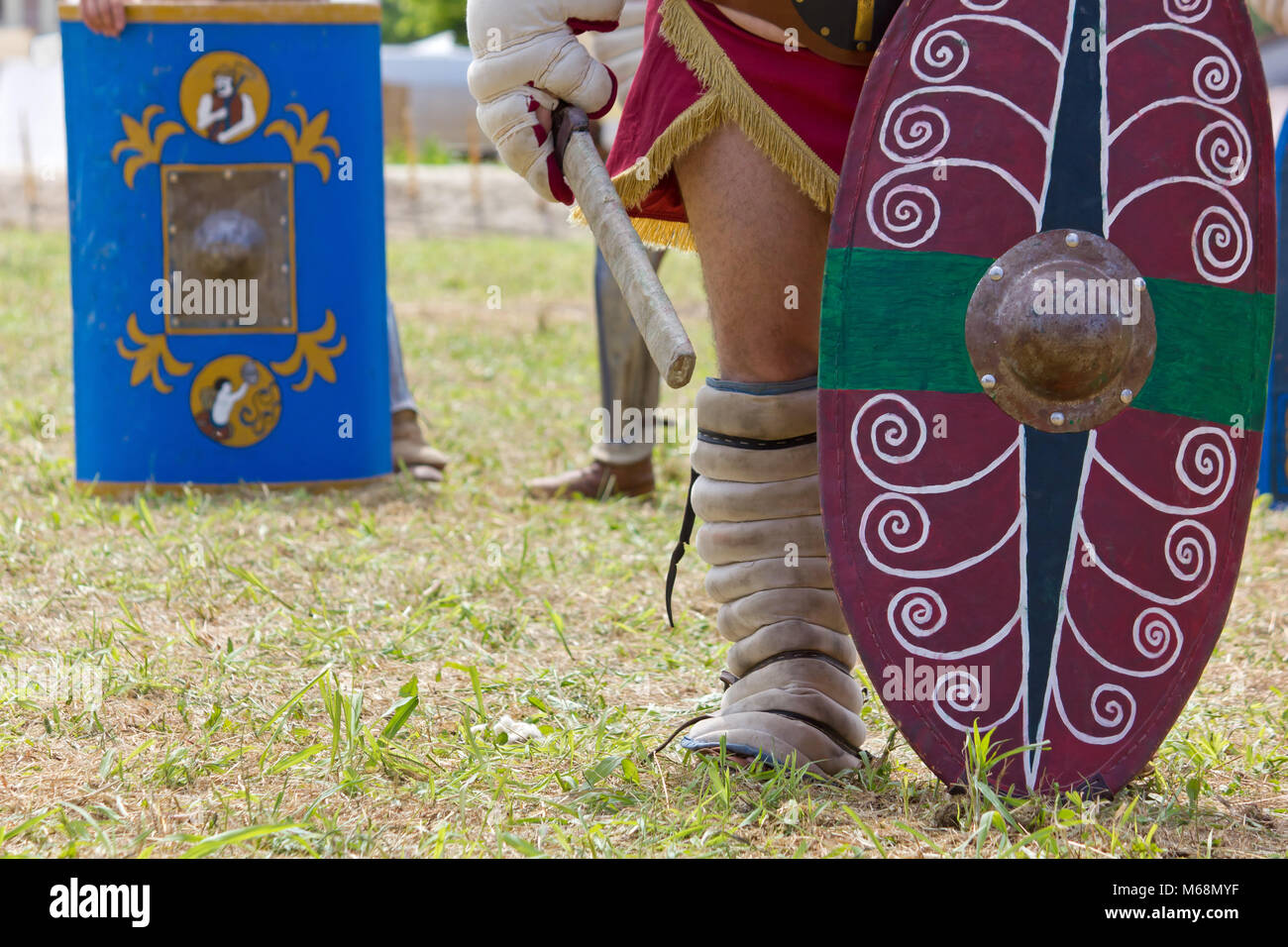 Painted battle shields carried by ancient gladiators at a historical reenactment Stock Photo