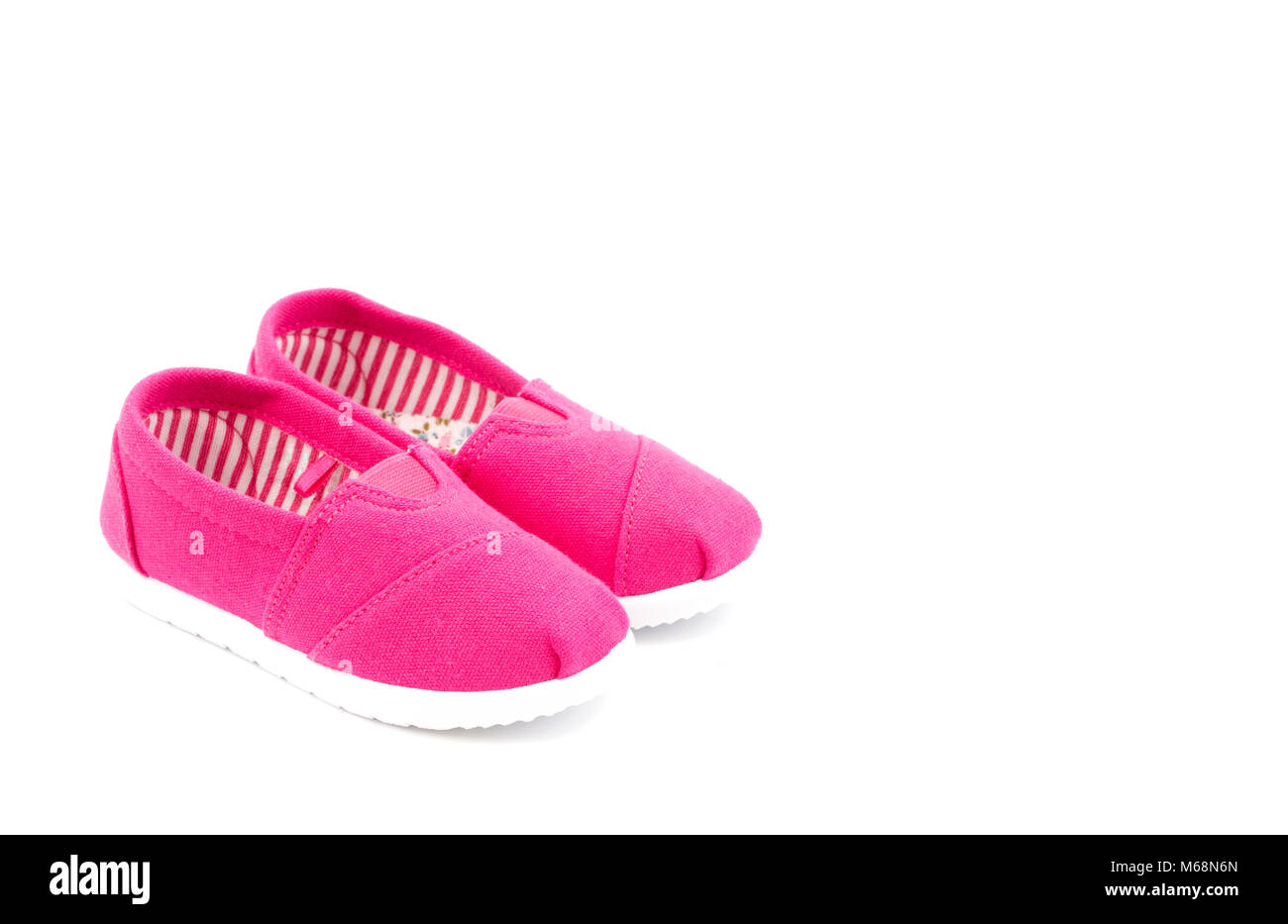 Pair of Pink Children's Shoes on a White Background Stock Photo - Alamy