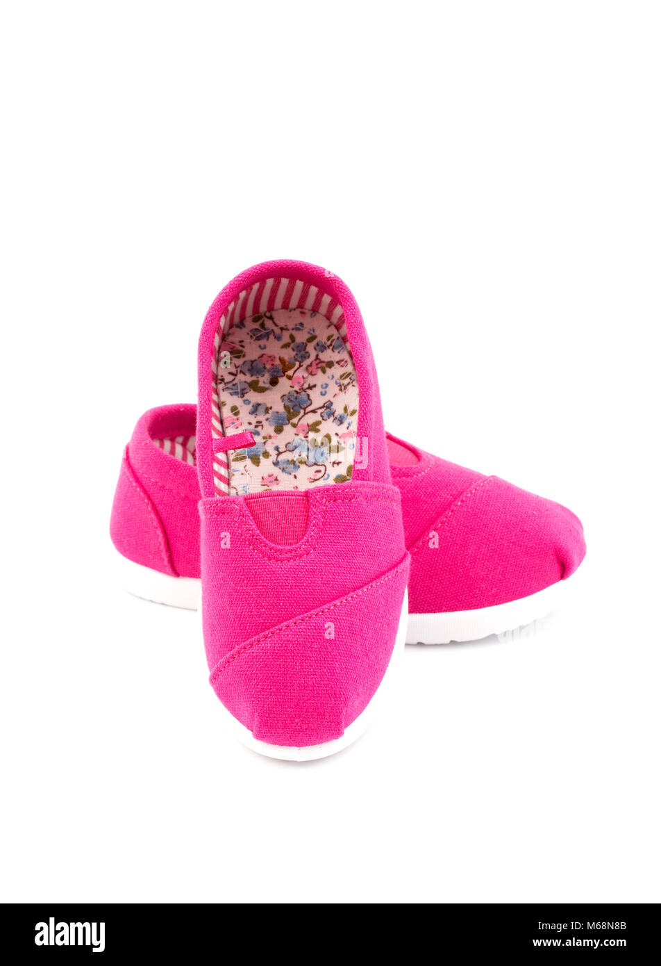 Pair of Pink Children's Shoes on a White Background Stock Photo - Alamy