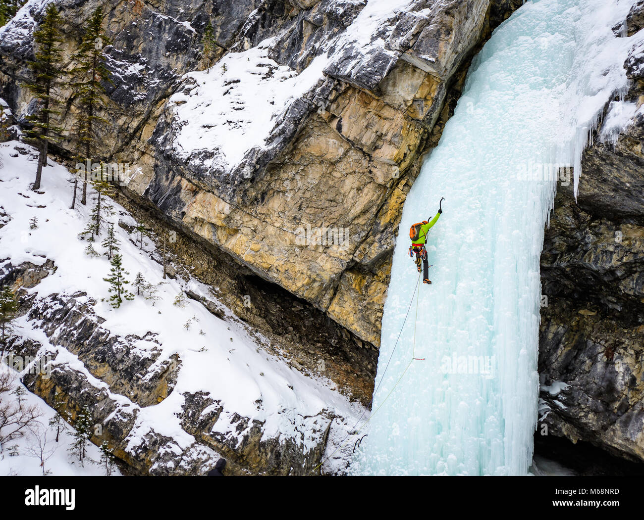 Elijah Weber climbing Professor Falls rated WI4 in Banff National Park