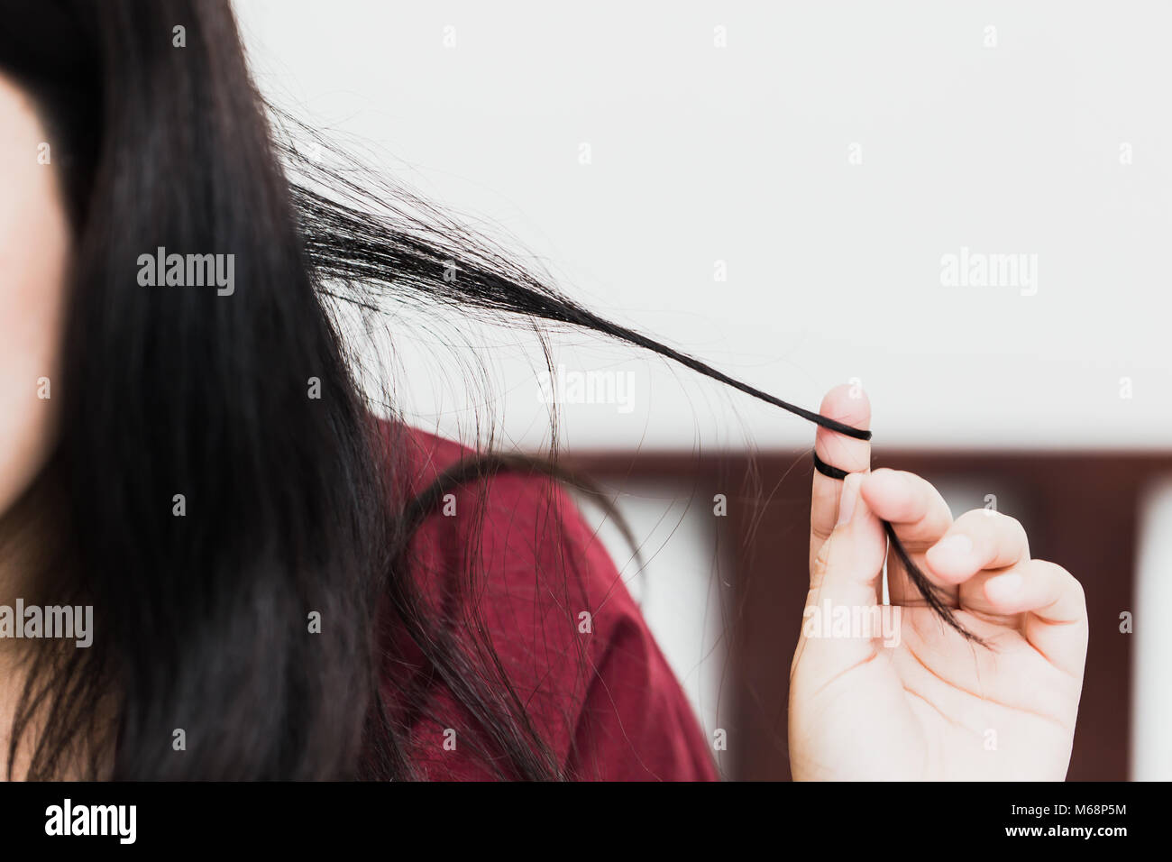 Trichotillomania or hair pulling disorder in mental health problem with stress or worry women Stock Photo