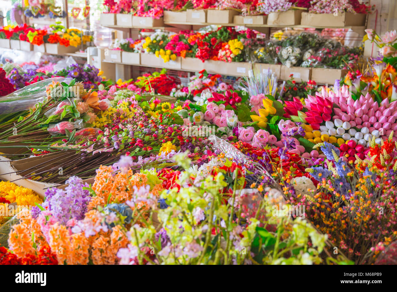 plastic flower shop beautiful colorful fake flora for home decoration Stock Photo Alamy