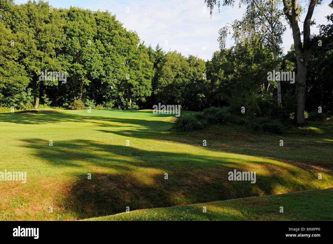 View over small ditch to the 11th Green with shadows, Langley Park Golf Club,  Beckenham, Kent, England Stock Photo - Alamy