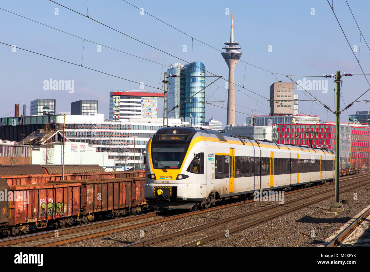 S-Bahn, Local train station, Dusseldorf-Hamm stop, the skyline of Düsseldorf city center, Medienhafen, Media port area,  commuter train, Düsseldorf, G Stock Photo