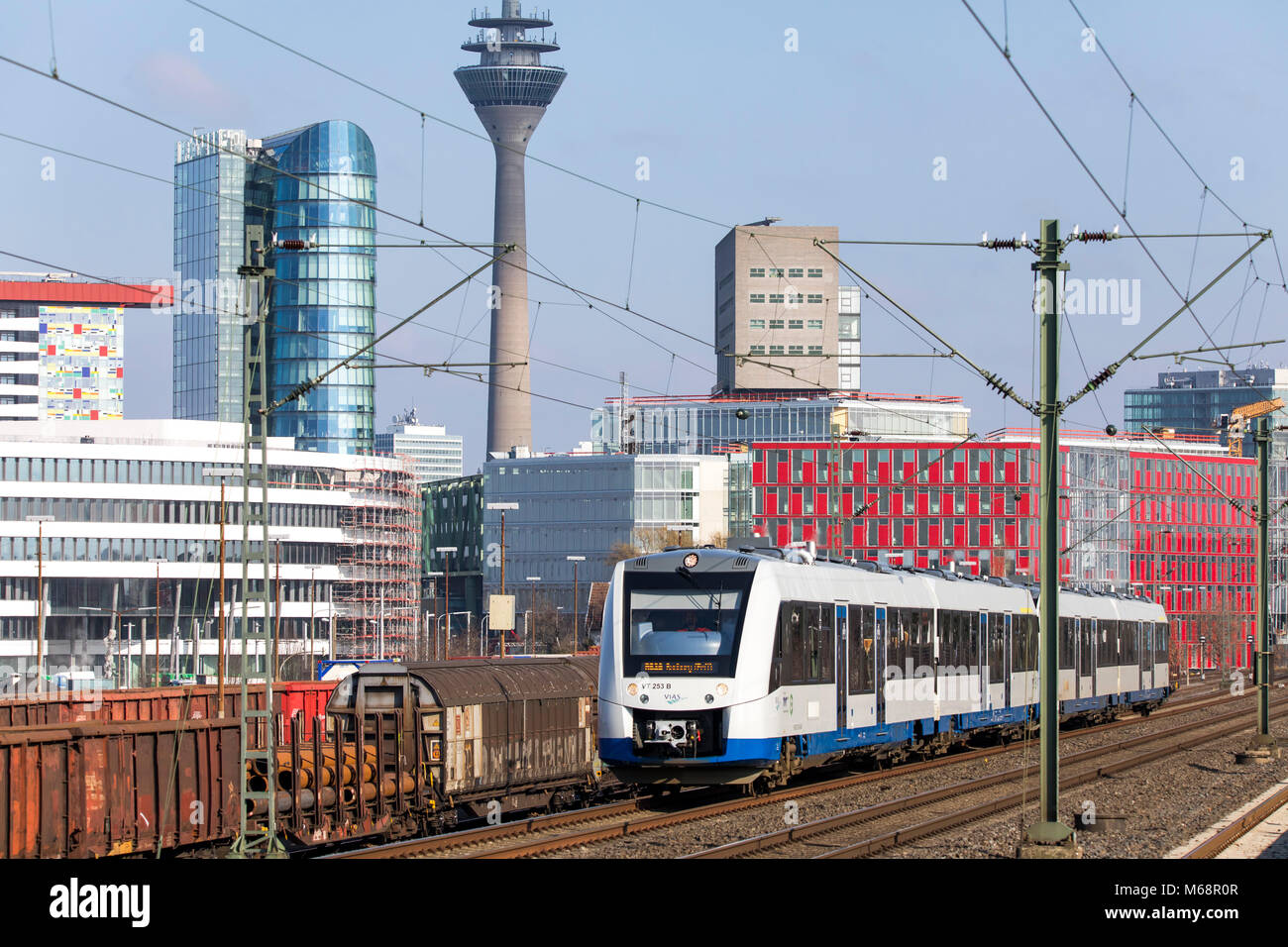 S-Bahn, Local train station, Dusseldorf-Hamm stop, the skyline of Düsseldorf city center, Medienhafen, Media port area,  commuter train, Düsseldorf, G Stock Photo