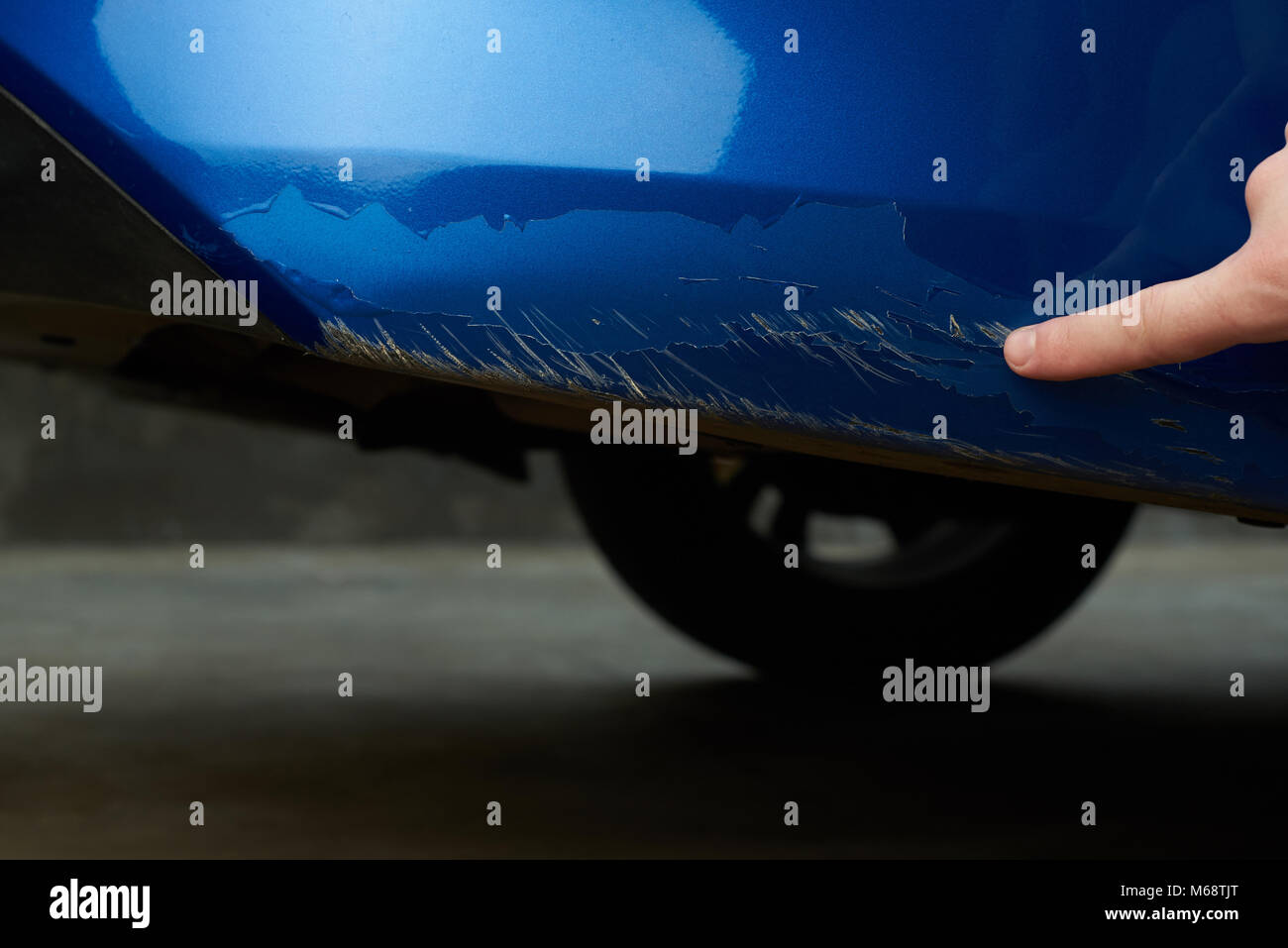Damaged car paint show man finger closeup Stock Photo Alamy
