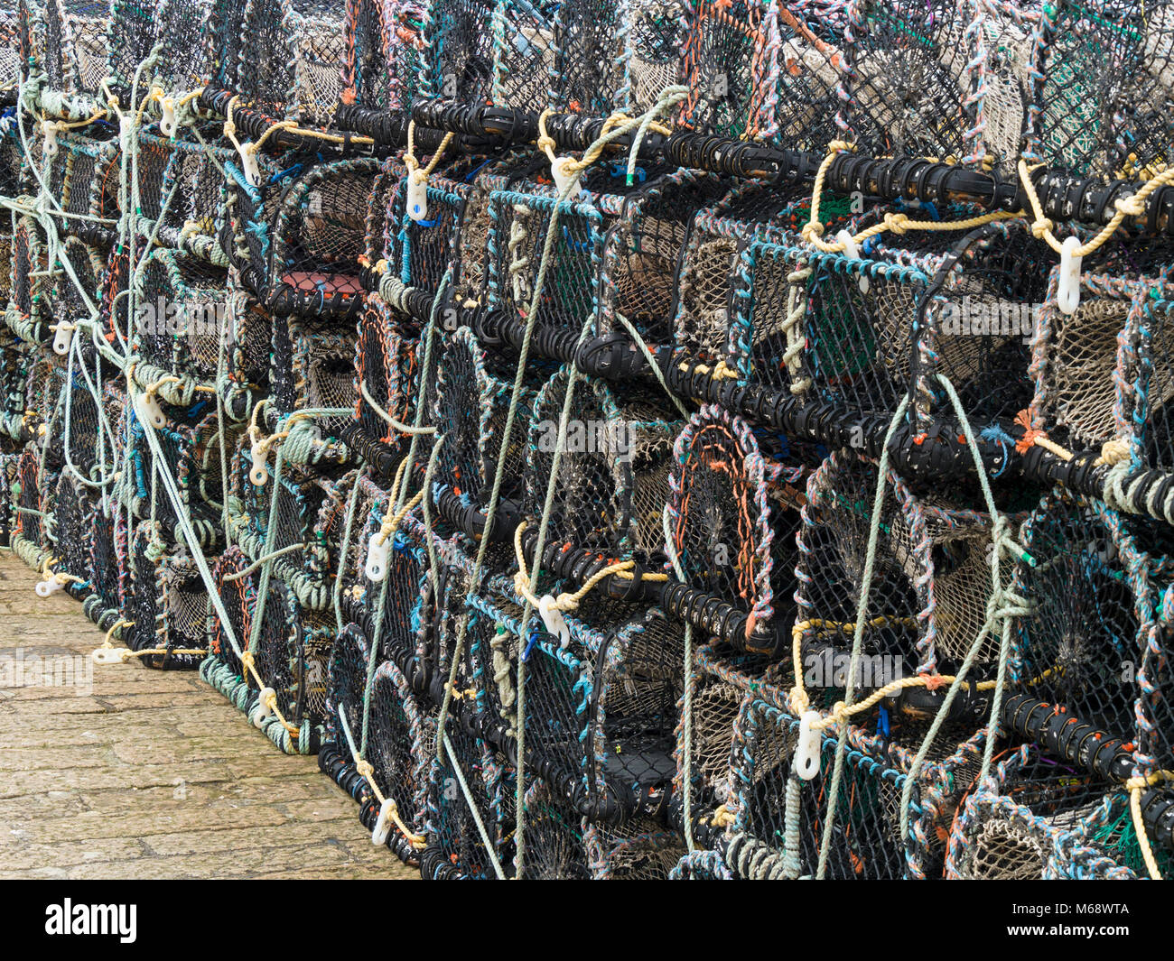 Stack of lobster and crab fishing pot cages creels, St. Ives, Cornwall, England, UK Stock Photo