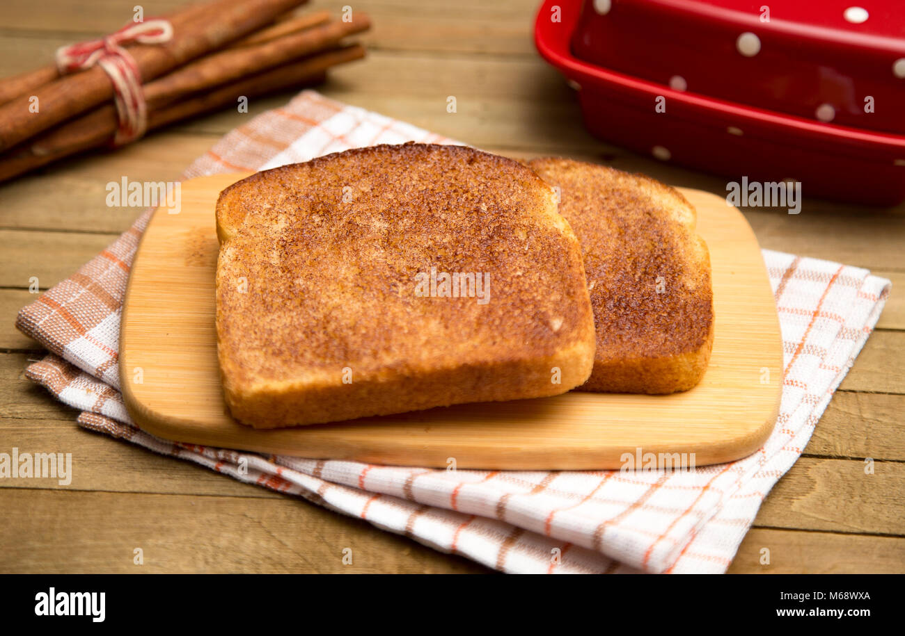 Classic Cinnamon Toast on a Rustic Wooden Table Stock Photo - Alamy
