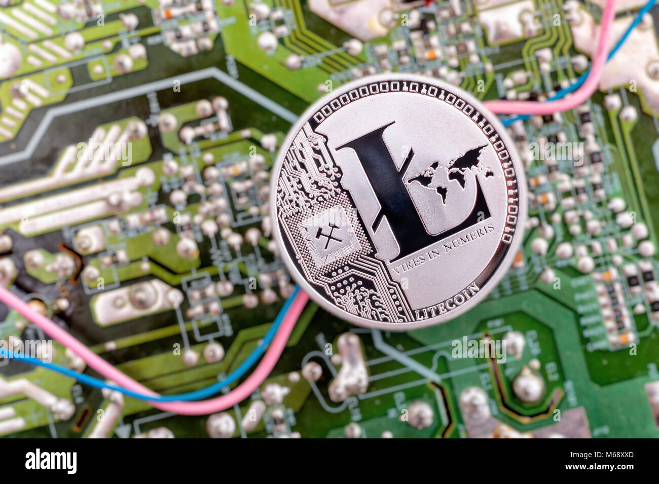 Circuit board and cryptocurrency Litecoin coin Stock Photo