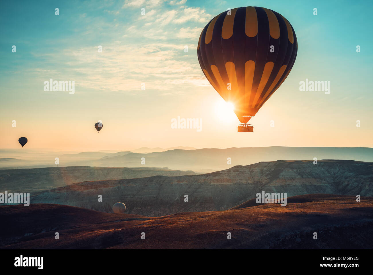 Hot air balloons flying over the valley at Cappadocia, Turkey Stock ...
