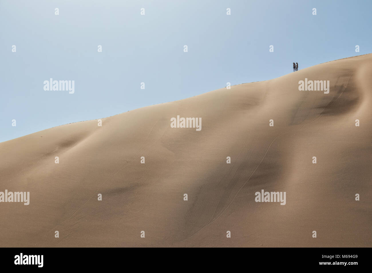 People climbing dune in the Namibia desert. Sossusvlei Stock Photo - Alamy