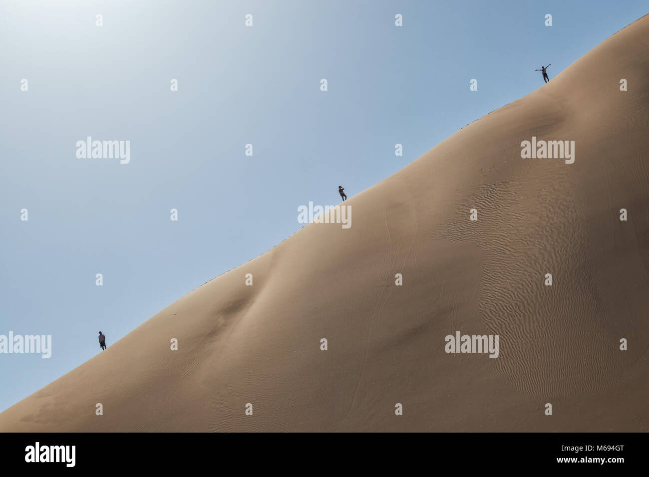 People climbing dune in the Namibia desert. Sossusvlei Stock Photo - Alamy